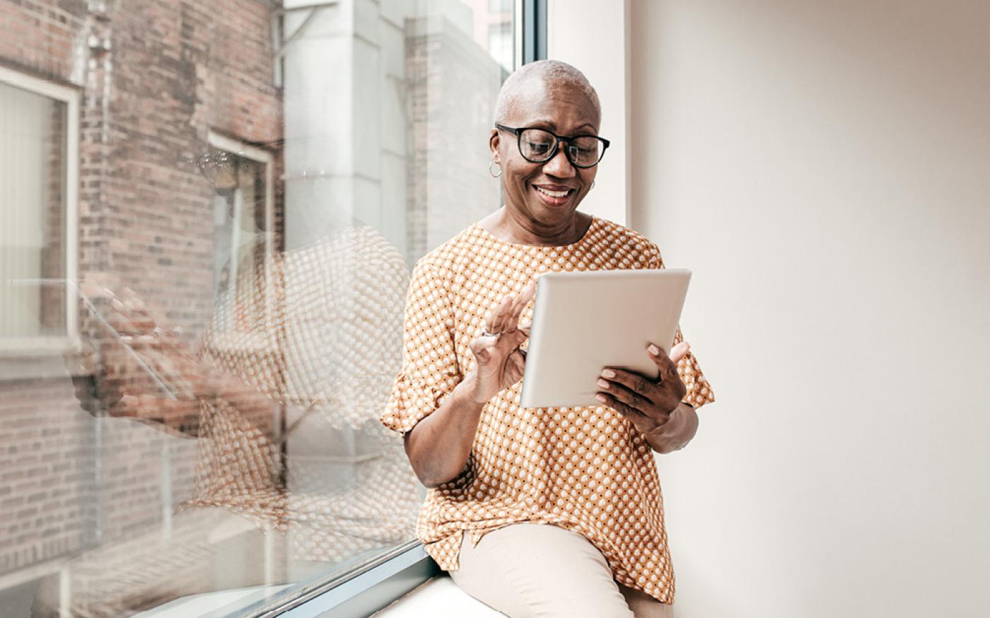 woman-scrolling-on-a-tablet